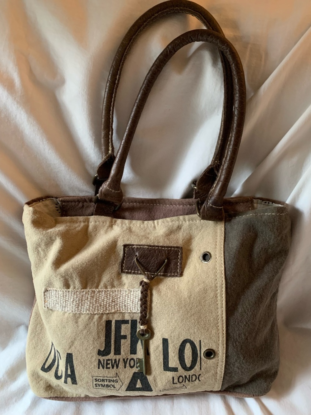 Myra Bag canvas with airport graphics and double leather handles